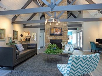 Clubroom With Fireplace at Windmill Apartments, Colorado Springs, CO